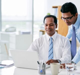 two business men at computer