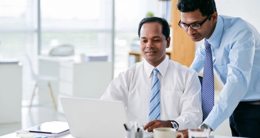 two business men at computer